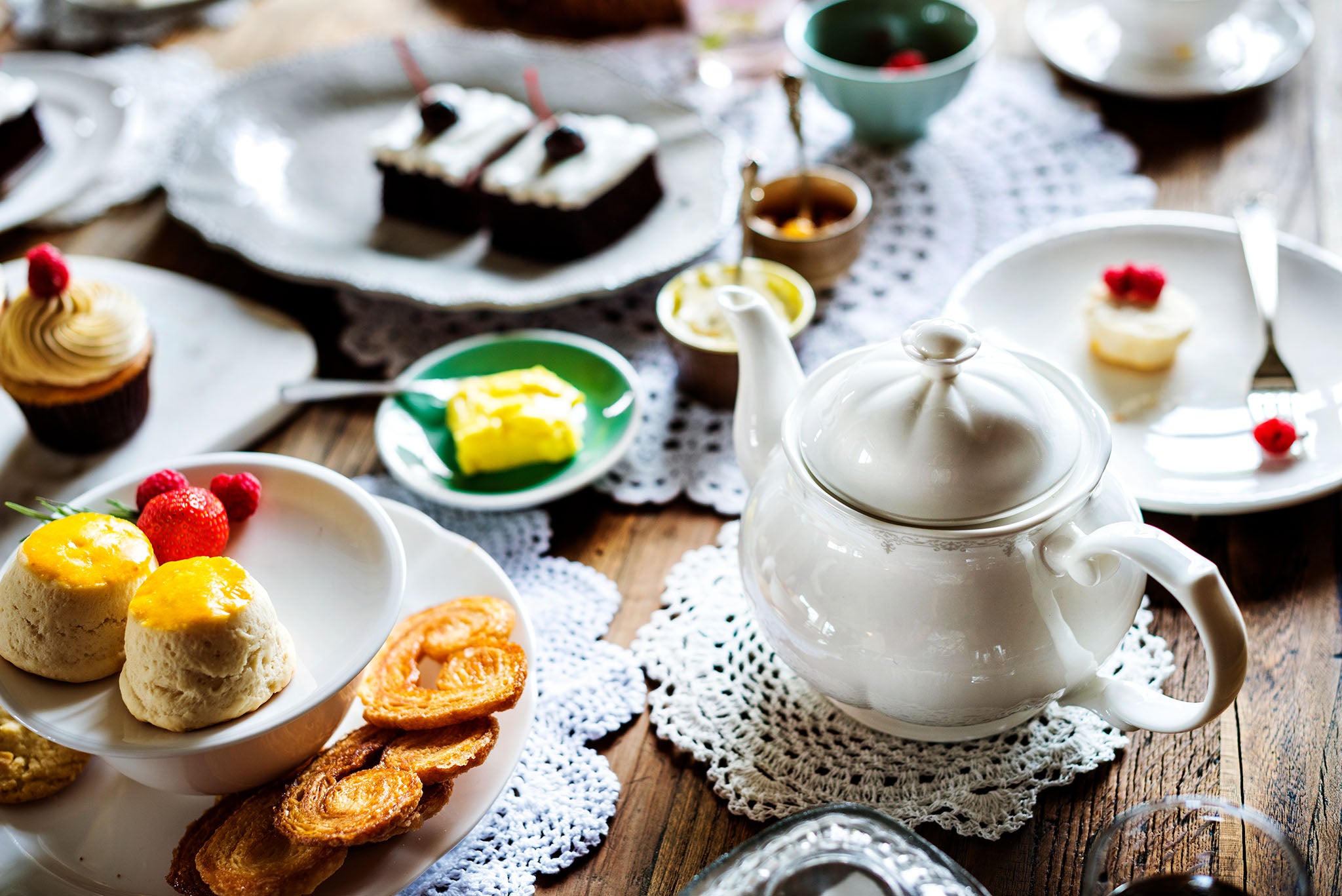 Tea room with teapot and cakes.