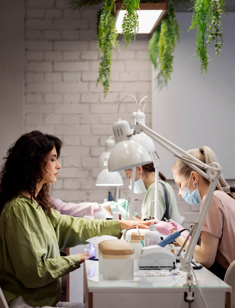 Professional manicurist working on a client's nails