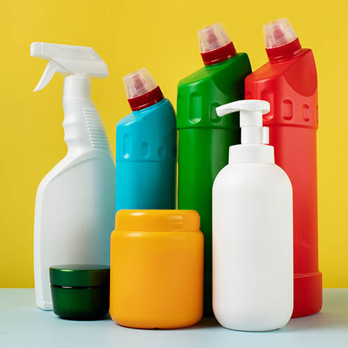 A selection of cleaning products in colourful bottles.