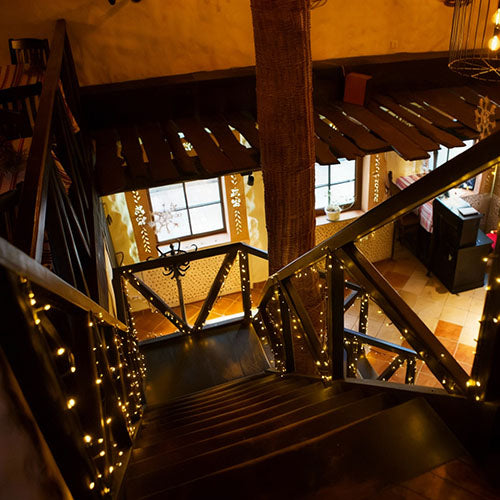 A view down a steep staircase in an Airbnb rental property holiday let.