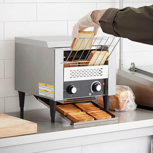 Commercial toaster being used in a tearoom kitchen.