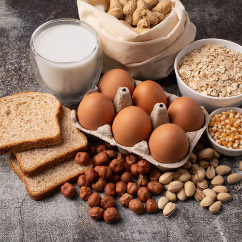 A selection of foods containing allergens commonly found in a bakery or cake shop.
