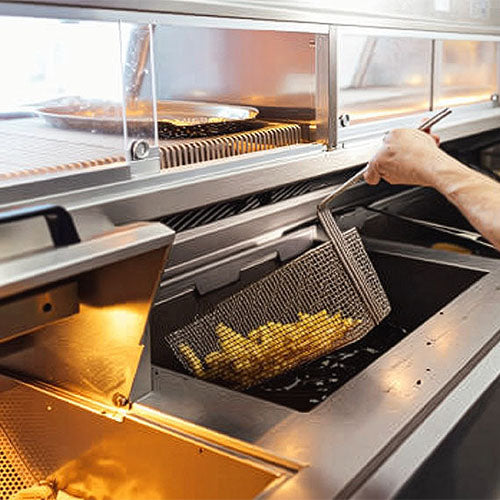 Hot cooking equipment in a fish and chip shop.