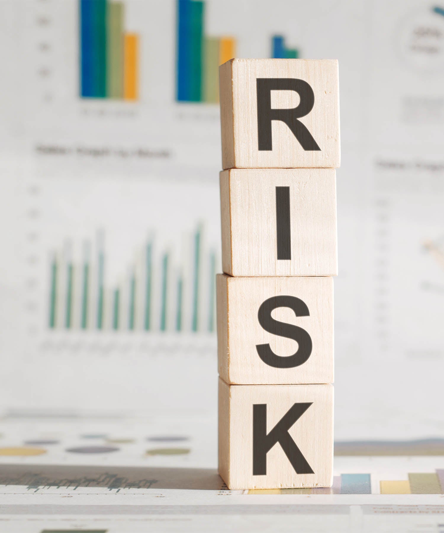 Wooden blocks spelling out the word 'risk' in relation to businesses.