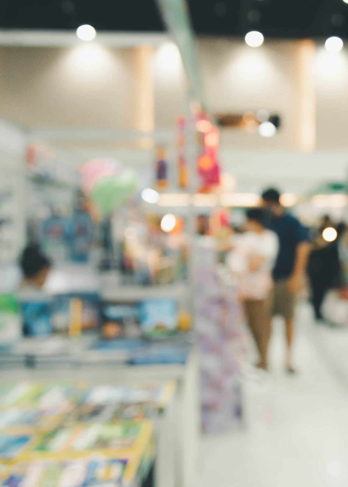 Blurry photo of a retail store with customers browsing products