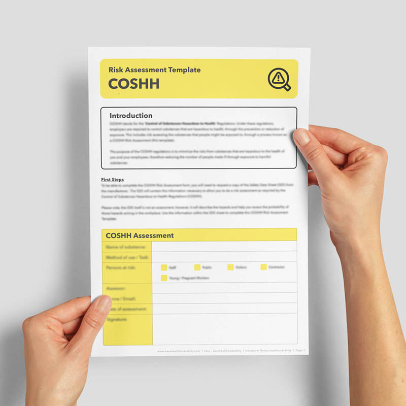 Hands holding a coshh assessment template