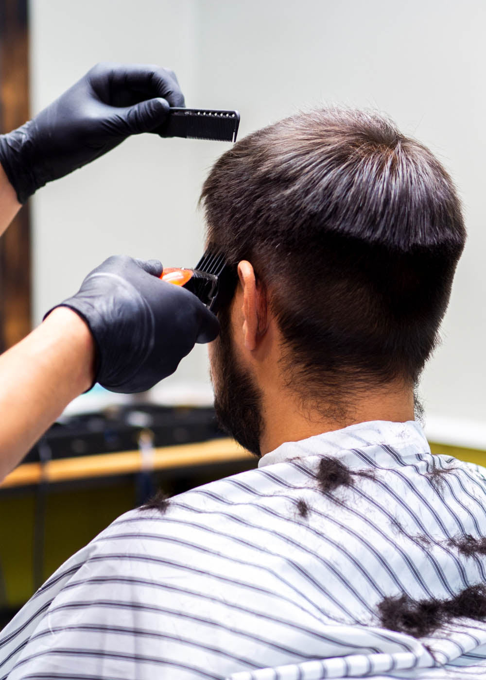Man having his hair cut with some clippers