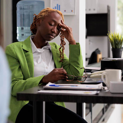 Office worker showing signs of work related stress