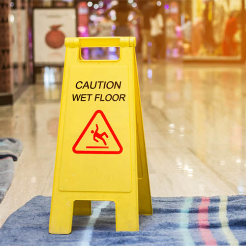 Wet floor sign inside a retail store.
